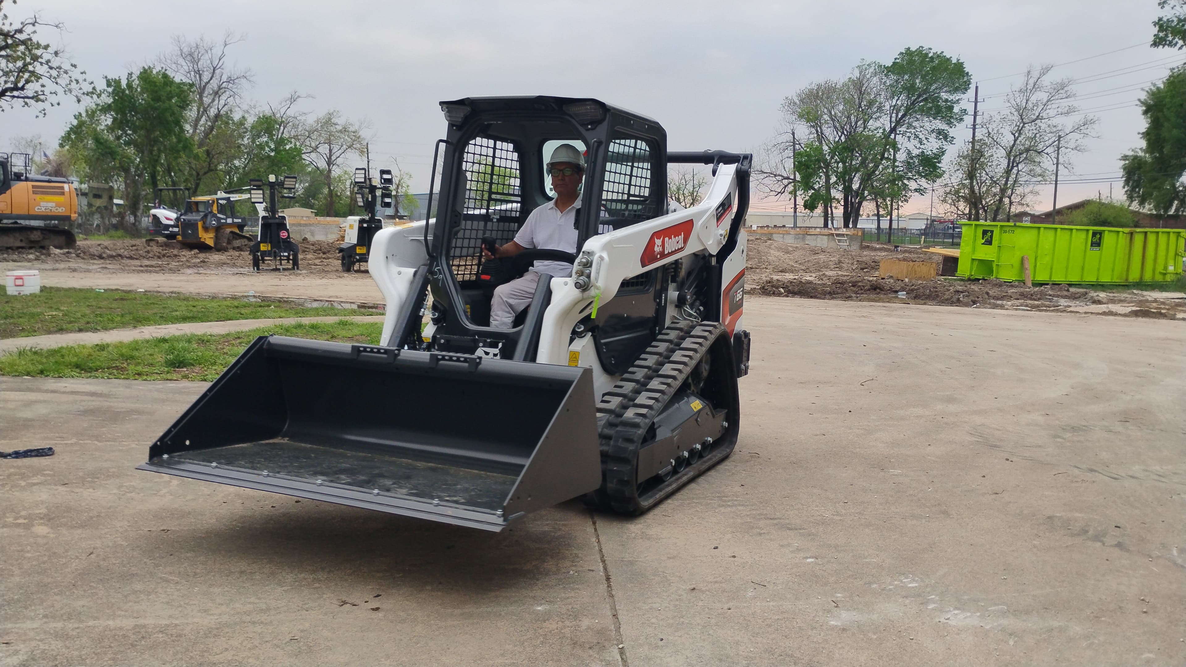 Bobcat T66 compact track loader at a Houston jobsite with an operator inside the cab.