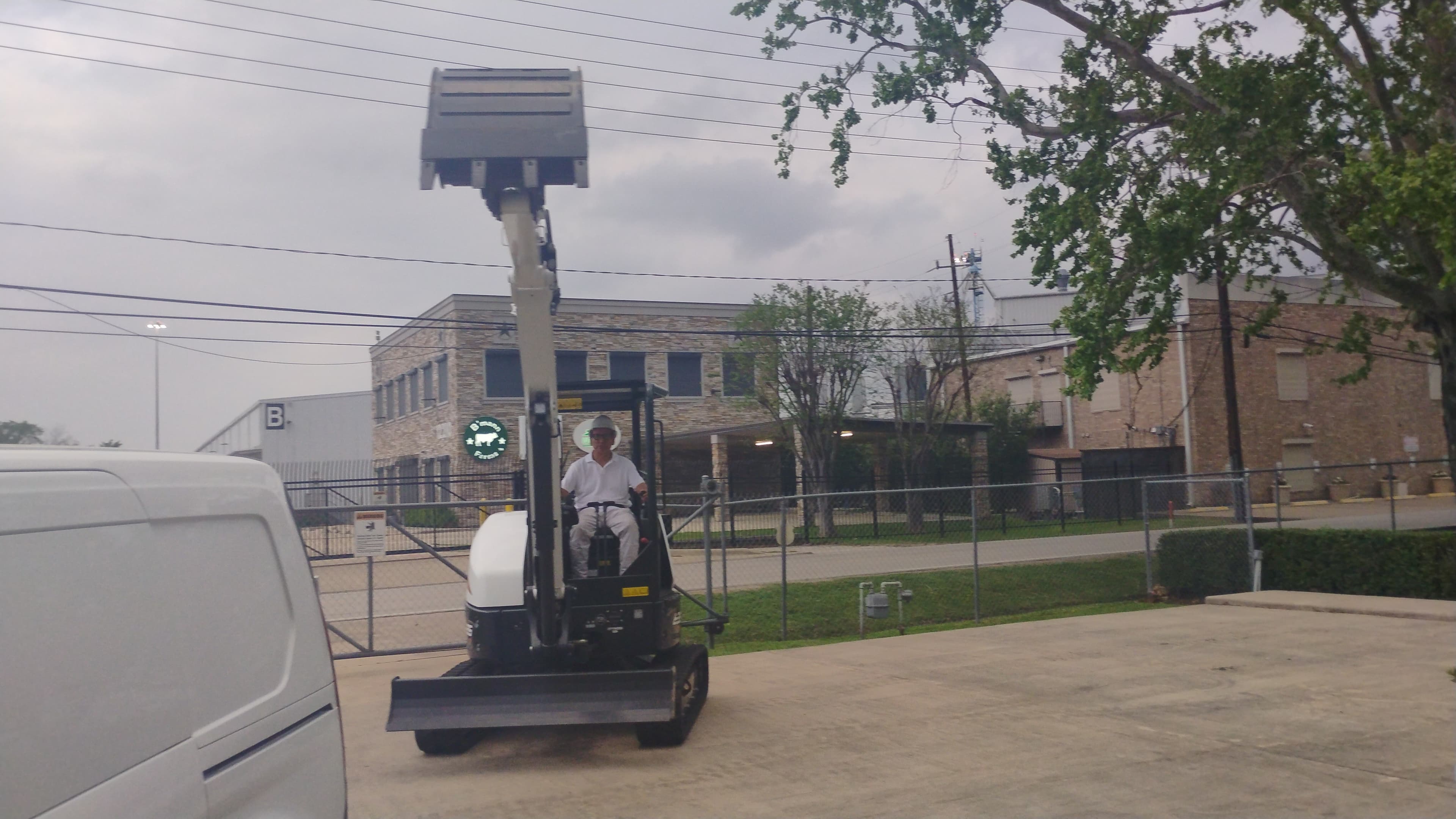 Front view of the Bobcat E35 compact excavator in Houston with the arm extended outward over the blade.