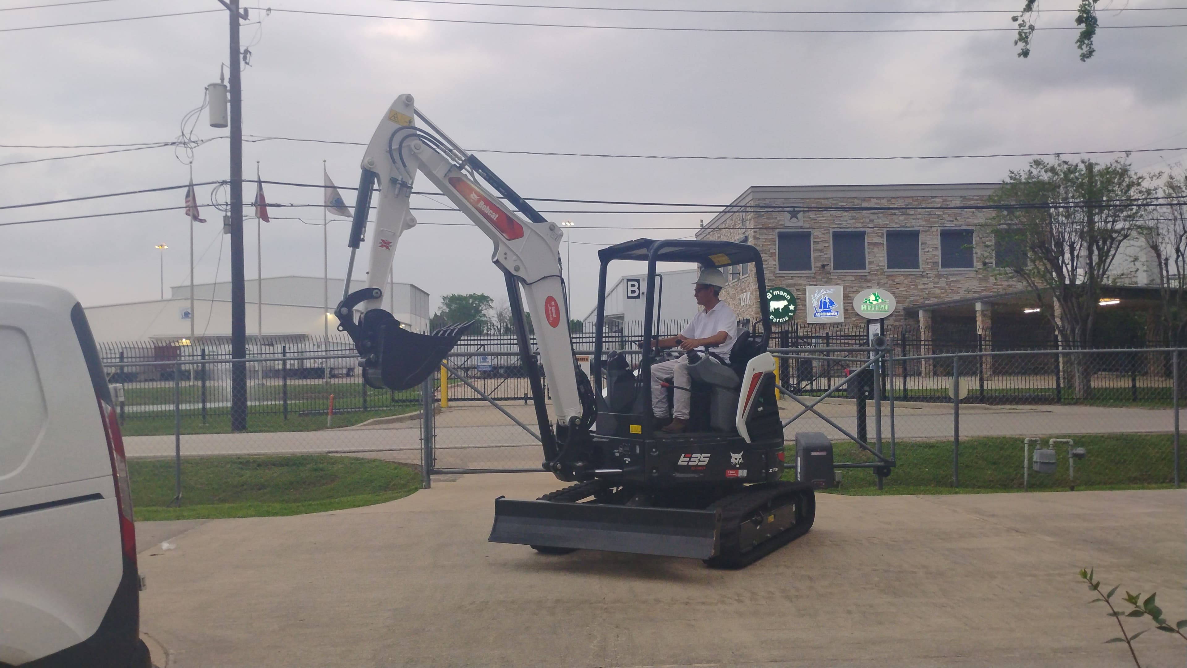 Bobcat E35 compact excavator side view in Houston with the boom partially extended.