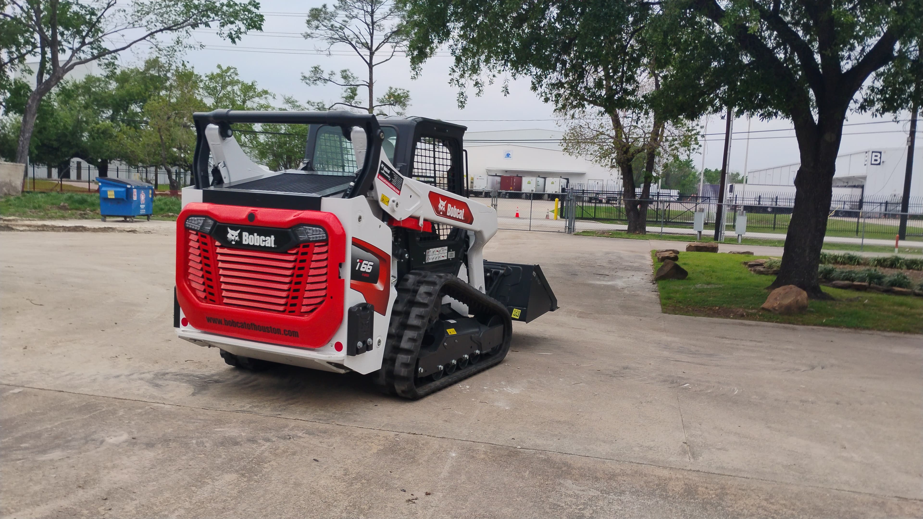 Rear three-quarter view of the Bobcat T66 compact track loader in Houston showing the machine body and tracks from behind.